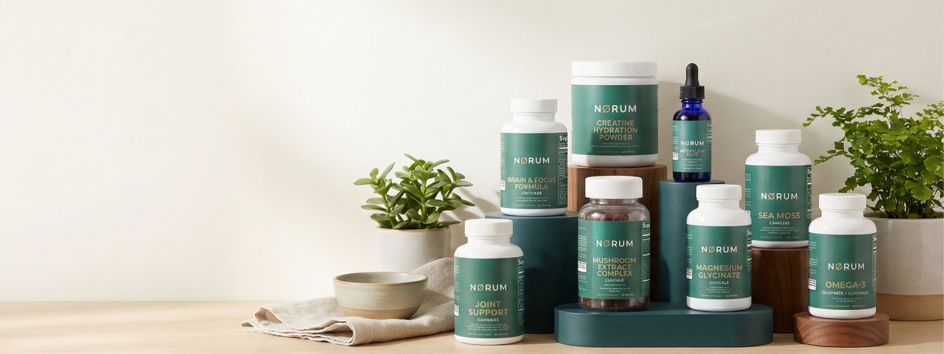 Assortment of green-labeled wellness supplements and vitamins on display with plants