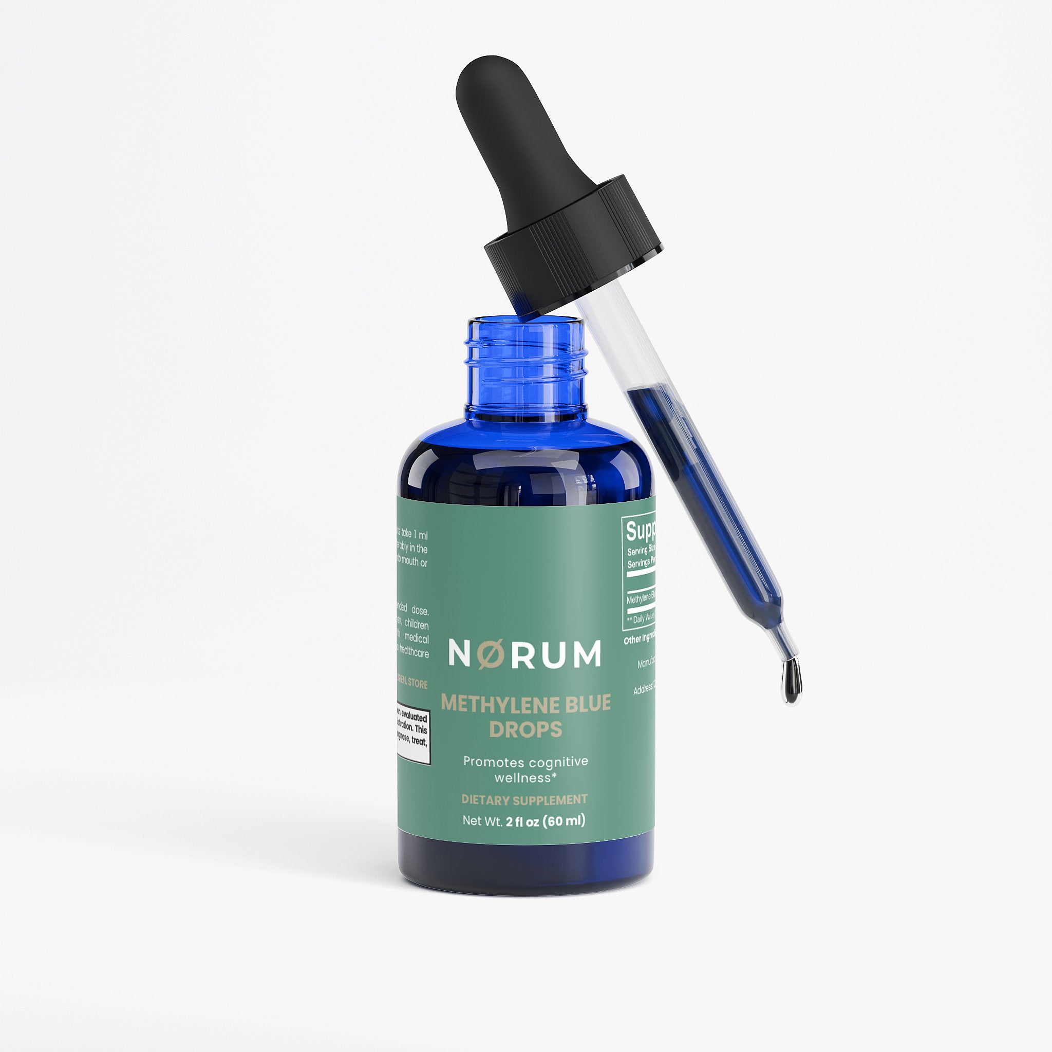 Blue glass bottle of methylene blue dietary supplement drops with dropper on white background