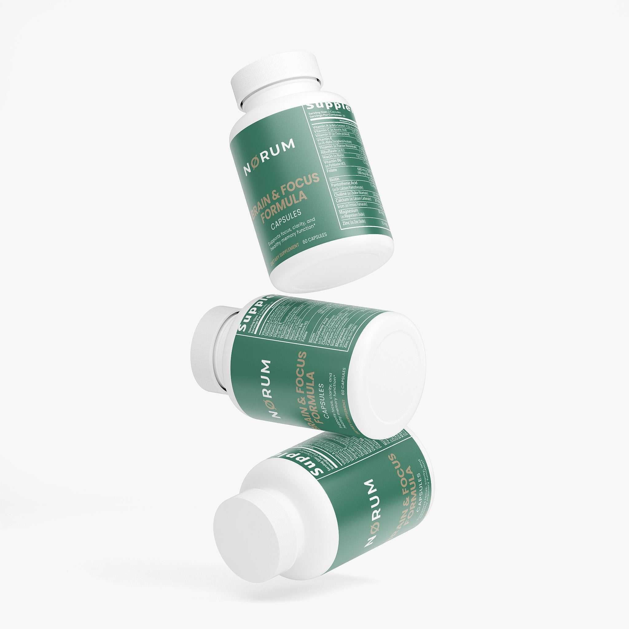 Three green bottles of Brain & Focus Formula capsules with white labels floating on white background