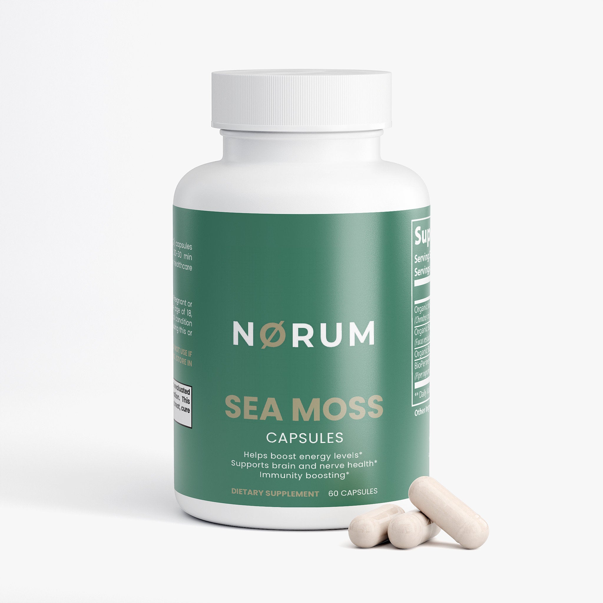 Sea moss capsules bottle with three supplement pills on white background