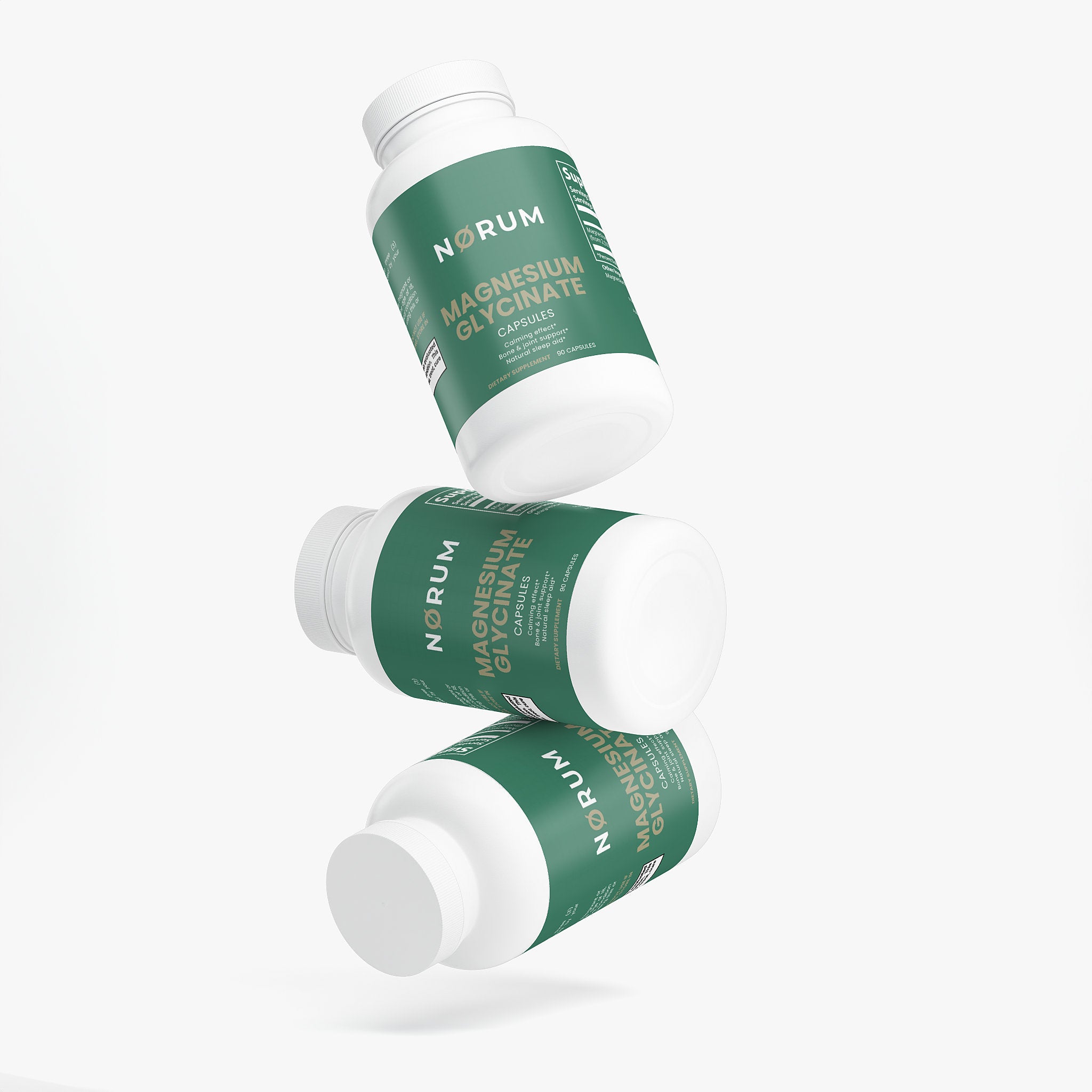 Three bottles of magnesium glycinate capsules with green labels on a white background.